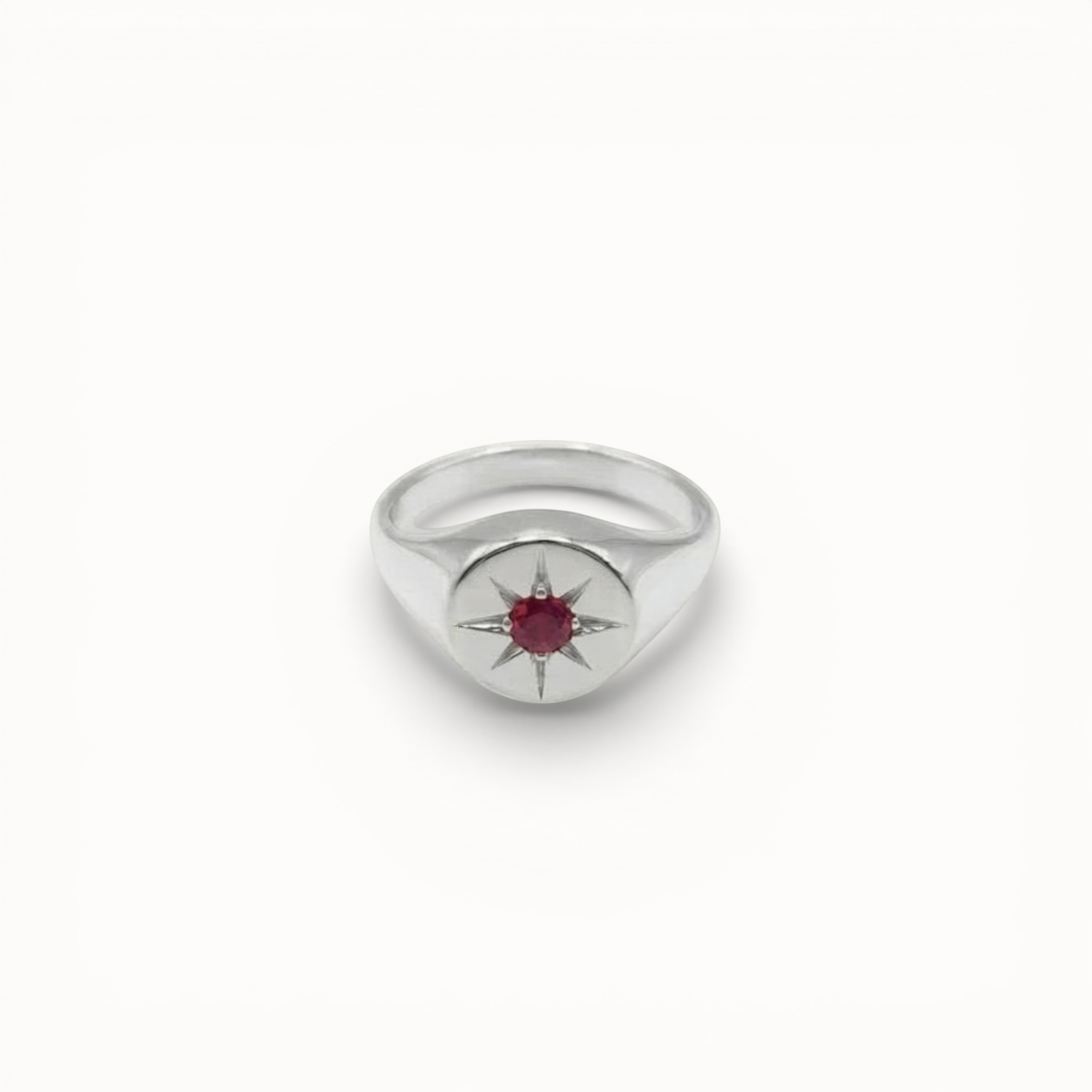 Loen Jewelry silver signet ring with red starburst gemstone, inspired by Parisian New Wave.