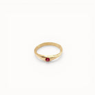 Loen Jewelry gold-plated ring with a small red stone and engraved band, inspired by Parisian charm.