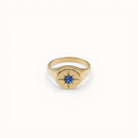 Loen Jewelry gold signet ring with blue sapphire starburst center. Inspired by Parisian New Wave.