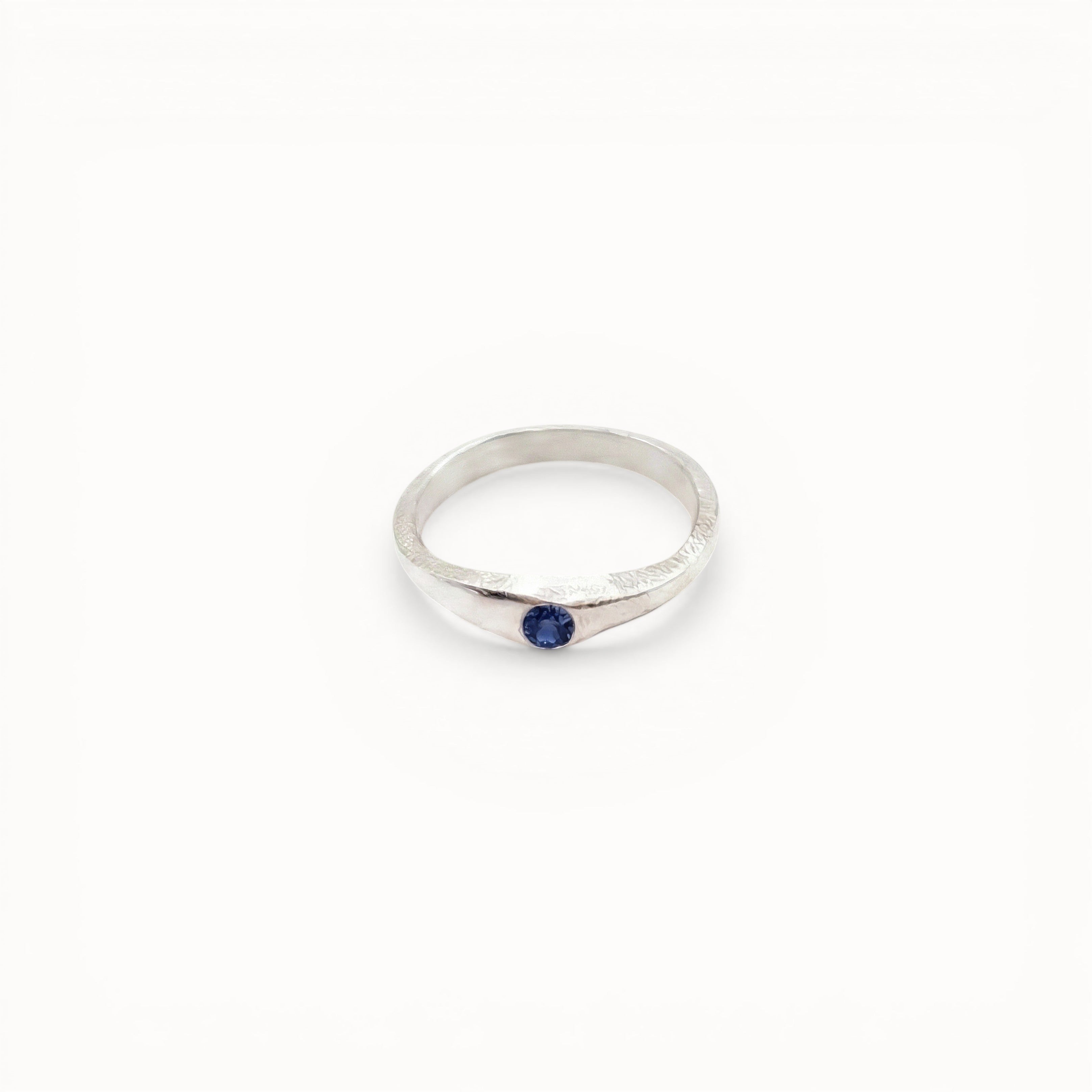 Loen Jewelry silver ring with blue sapphire accent, inspired by Parisian charm. Sterling silver, handmade.